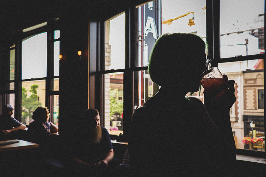 drinking by window